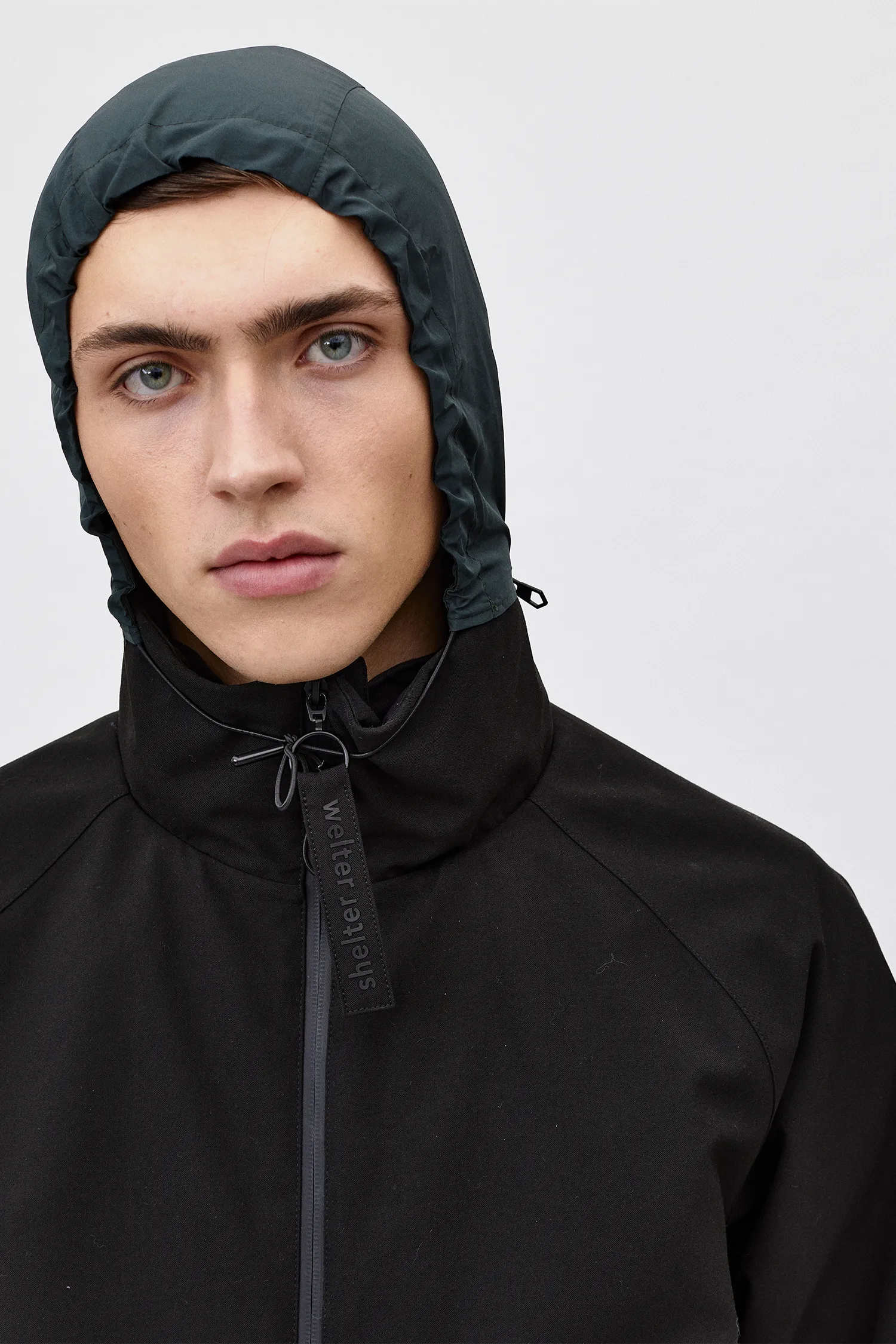 Certainly! Here is an optimized version of the product title with modifiers:

ROSS G Poly Coat - Mens Black AW21 Collection